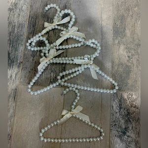 Quantity of 5 Pearl and white bow toddler sized outfit hangars